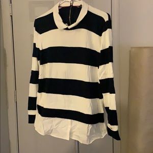 Sweater layered over woven